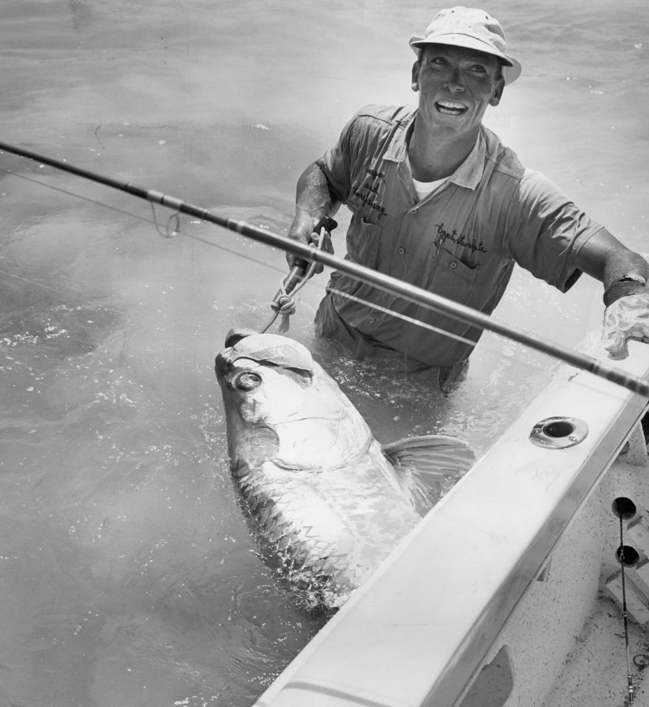 Russian modern male fisherman fishes on an ultralight spinning rod