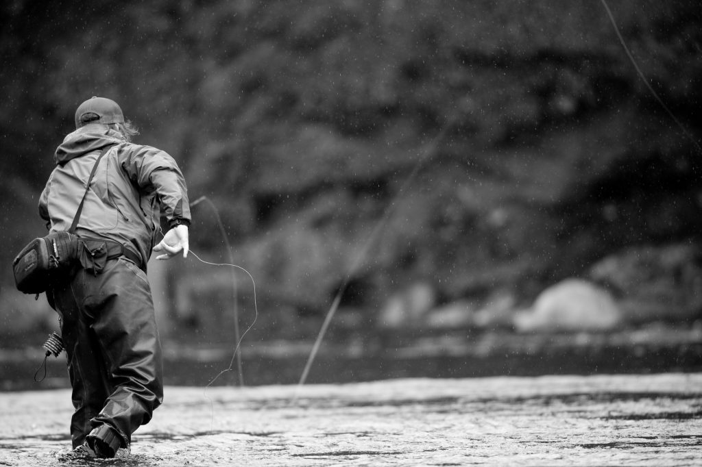 fly fisherman casting